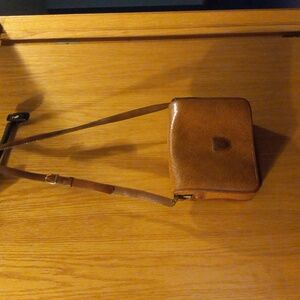 Womens leroy crossbody bag brown straps have some wear inside pockets have wear